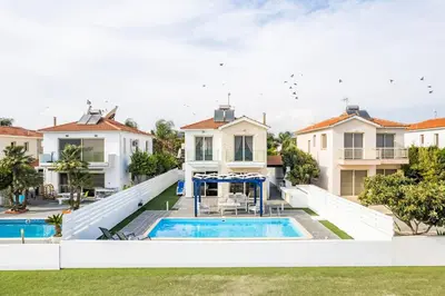 an aerial view of a house with a swimming pool at Villa Waves in Mazotos