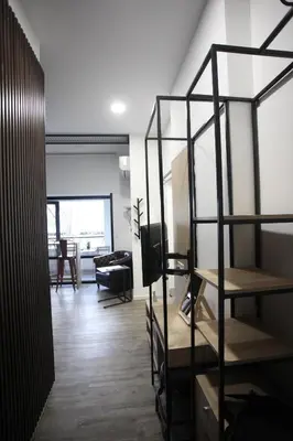 a room with shelves and a living room at G.R City Heart in Nicosia