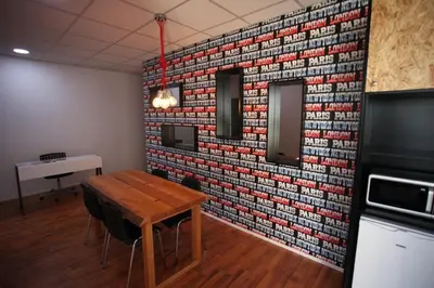 a room with a table and a brick wall at G.R City Heart in Nicosia