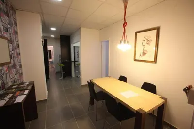 a conference room with a wooden table and chairs at G.R City Heart in Nicosia
