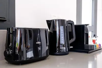 two coffee pots sitting on a kitchen counter at Noir Luxury Residences by Nomads in Limassol