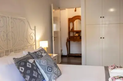 a bedroom with a bed with two pillows on it at Maison du Mont in Kalopanayiotis