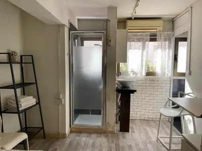 a bathroom with a shower and a sink at Archangelos Studio in Strovolos