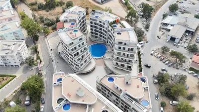 an aerial view of buildings in a city at Girne Merkezde Geniş Teraslı Havuzlu Daire in Alsancak