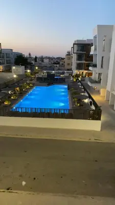 a large swimming pool on the roof of a building at Fall In Paradise in Paralimni