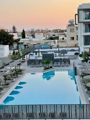 an overhead view of a large swimming pool in a building at Fall In Paradise in Paralimni