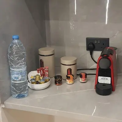 a bottle of water sitting on top of a counter at Amato Beach in Limassol