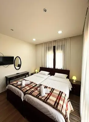 a bedroom with two beds with towels on them at Kyperounta Heights - Breathtaking View in Kyperounda