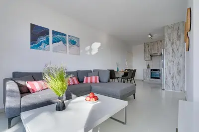 a living room with a couch and a table at Elisabeth Salt Lake views 200m from Makenzy beach in Larnaka