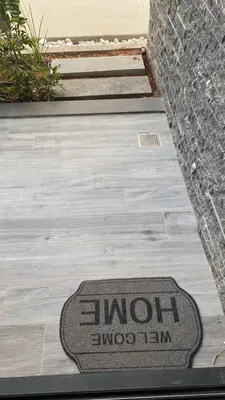 a mat on a sidewalk with the words molmoim on it at Grand Sappfıre Resort Iskele in Larnaka