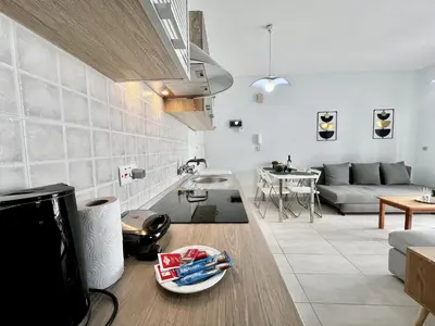 a living room with a couch and a table at STAY McKenzie Mile in Larnaka