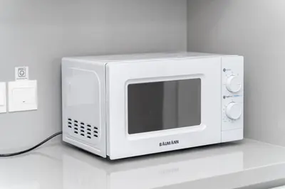a white microwave sitting on top of a counter at New 2 bedroom flat in Aglantzia in Aglantzia