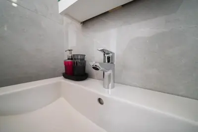 a bathroom with a sink with a faucet at New 2 bedroom flat in Aglantzia in Aglantzia