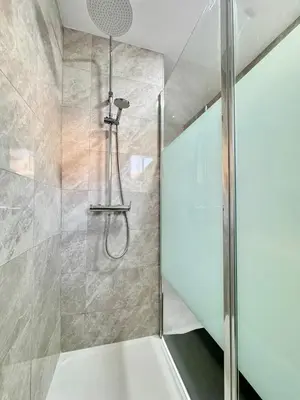 a shower with a glass door in a bathroom at Napa Skyline Suite 3BR Sunset Views and Pool in Ayia Napa