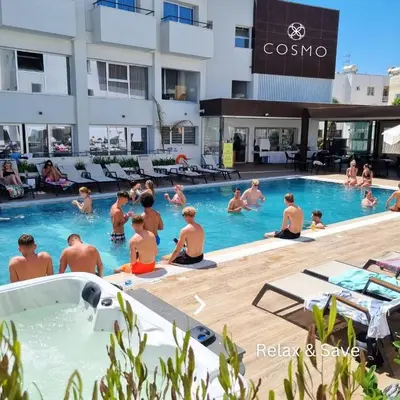 a group of people sitting in a swimming pool at Napa Skyline Suite 3BR Sunset Views and Pool in Ayia Napa