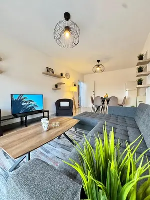 a living room with a couch and a table at Napa Skyline Suite 3BR Sunset Views and Pool in Ayia Napa