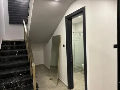 a staircase with a glass door in a building at Veray Homes Villa in Ayios Dhometios
