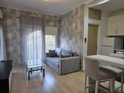 a living room with a couch and a table at White Arches Haven by Staycom in Limassol