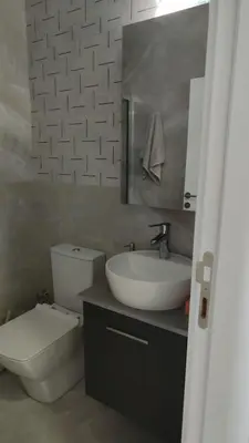 a bathroom with a white sink and a toilet at Studıo Iskele 150 in Aglantzia