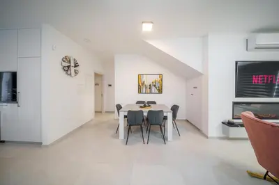 a dining room with a table and chairs at Villa Oro Hills w private hot tub jacuzzi in Voroklini