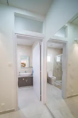 a bathroom with a toilet and a sink at Villa Oro Hills w private hot tub jacuzzi in Voroklini