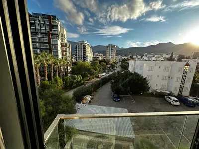 a view from a balcony of a city at Avrasya site, Luxury one-bedroom apartment in Kyrenia city center