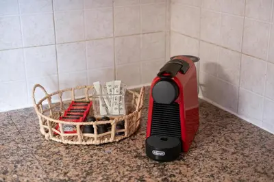 a hair dryer sitting on a counter next to a basket at Downtown Stadium 3 Bedroom Apartment in Larnaka