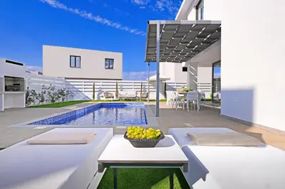 an image of a villa with a swimming pool at Villa Elizabeth - Pernera Resort Center in Paralimni