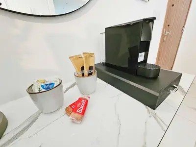 a counter with two trash cans and a mirror at Alexander Residence Trikallon Str in Nicosia