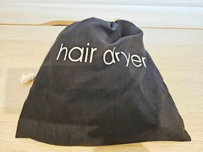 a black towel with the word hair dye written on it at Alexander Residence Trikallon Str in Nicosia