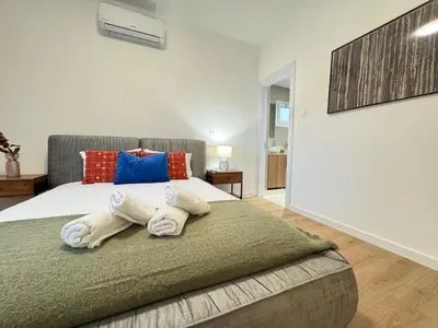 a bedroom with a bed with towels on it at GameHouse in the City Center in Nicosia