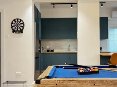 a ping pong table in a kitchen with billards on it at GameHouse in the City Center in Nicosia