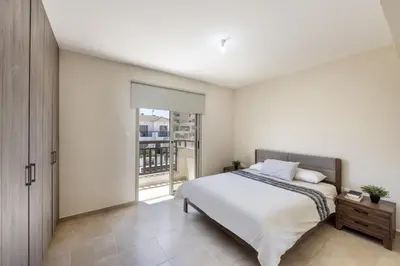 a bedroom with a large bed and a window at SunnyVillas 3BR House Private Pool POLY in Protaras