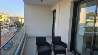 two chairs sitting on the balcony of a building at STAY Engomi Gem 2 in Engomi