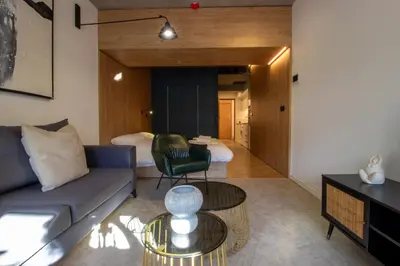 a living room with a couch and a table at M-Studios - Luxury studios in the heart of Limassol in Limassol