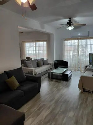 a living room with a couch and a table at Panoramic Sea View Apartments in Larnaka