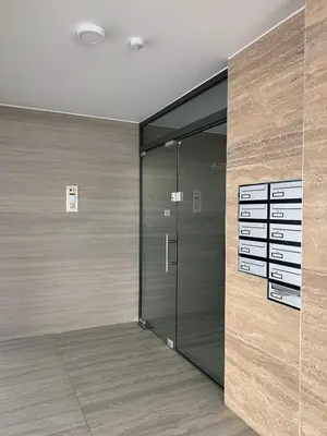 a walk in closet with a glass door at AFRODITI Living in Nicosia