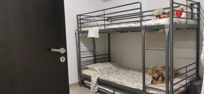 a room with two bunk beds with a dog in it at 2br-7 Guests-Free Parking-Pool-AirCon in Paralimni