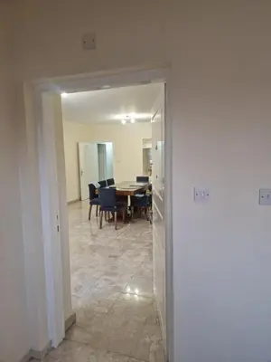 a dining room with a table and chairs and a mirror at Urban Nest Central Nicosia - Spacious 2BR Apartment in Nicosia