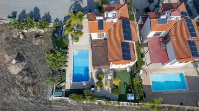 an aerial view of a house with a swimming pool at Sunnyside Family Villa in Protaras