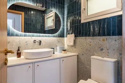 a bathroom with a sink and a toilet at Modern Luxury 2BR|Park View & Balcony in Nicosia