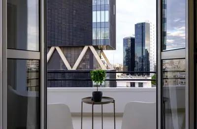 a room with a table and chairs and a window at Mnasiadou Suite 16 in Nicosia