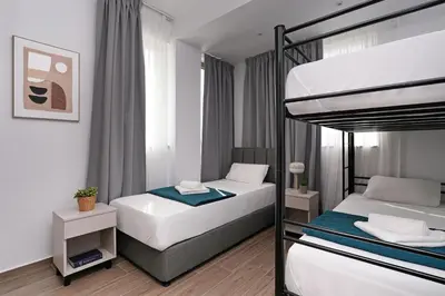 a bedroom with two bunk beds at Villa Elsa - Luxury Villa in Pernera in Paralimni