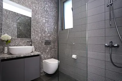 a bathroom with a shower and a toilet and a sink at Villa Elsa - Luxury Villa in Pernera in Paralimni
