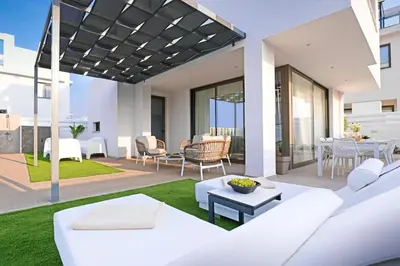 a living room and dining area of a house at Villa Elsa - Luxury Villa in Pernera in Paralimni