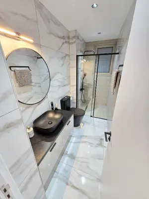 a bathroom with a sink and a shower at Mediterranean Sunrise Villa Protaras in Paralimni