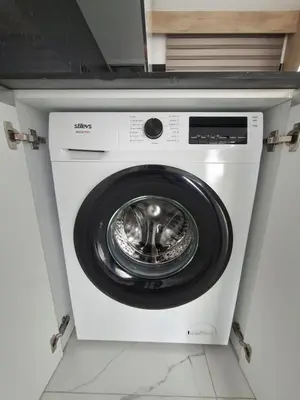 a white washing machine sitting in a room at Chic Blue Apartment with Terrace in Paralimni