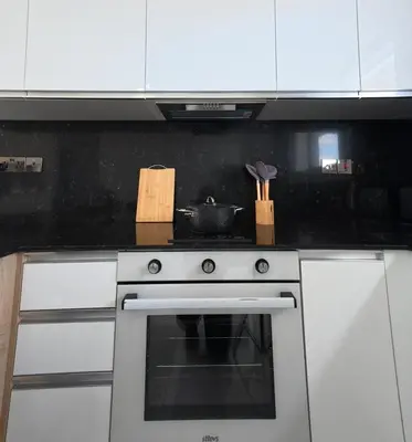 a kitchen with a stove with a pot on it at Chic Sunset Apartment with Terrace in Protaras