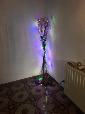 a vase with christmas lights in a room at ARTEMIS HOUSe in Kakopetria
