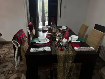 a dining room table with christmas decorations on it at ARTEMIS HOUSe in Kakopetria